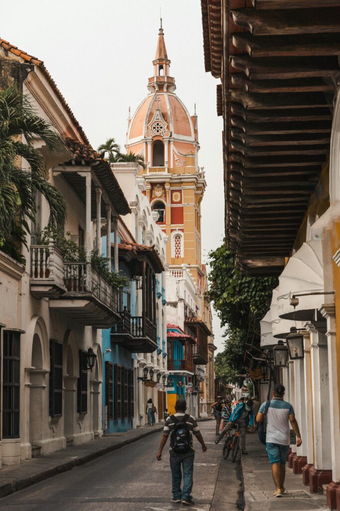 pexels-photo-17745834-17745834 Scenic street scene in Cartagena featuring the iconic cathedral tower.